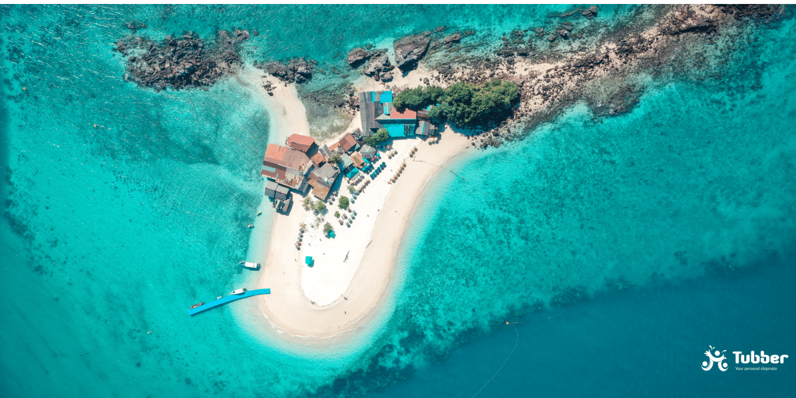 Aerial view of Koh Khai Nok, a tiny tropical island with white sand beaches, colorful rooftops, and turquoise water in Thailands Andaman Sea