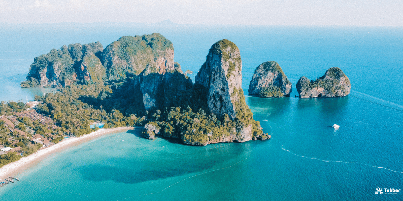 limestone cliffs, jungle coastline and tranquil turquoise waters near Krabi