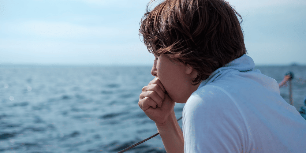 A man with seasickness on a yacht