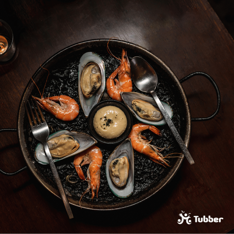 Black risotto with shrimps and mussels