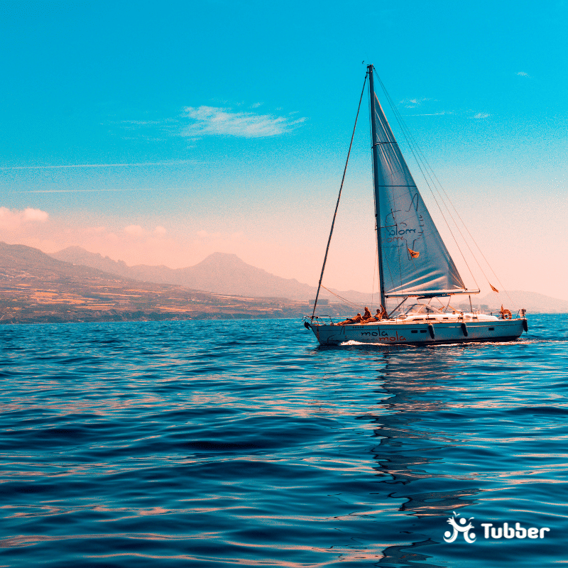 Sailboat Sailing on Water Near Island
